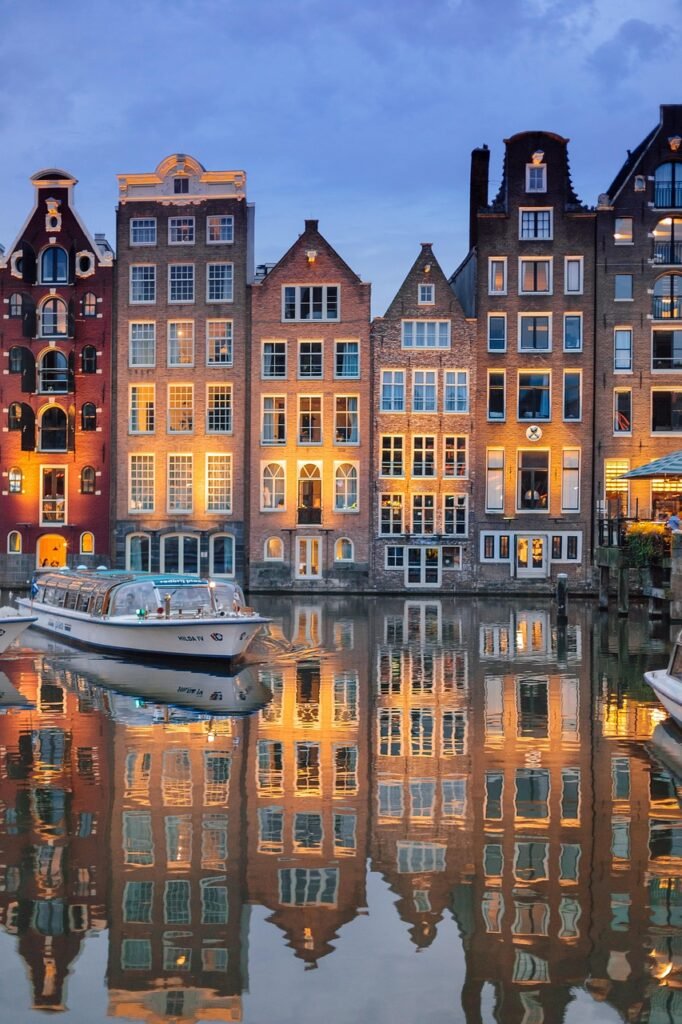 buildings, architecture, river, illuminated, reflection, mirror image, mirroring, phone wallpaper, boat, sailing, cruise, river cruise, amsterdam, nature, city, evening, night time, lights, netherlands, holland, water, sky, ship, tourism, amstelpark, amsterdam-buitenveldert, houses, aesthetic wallpaper, iphone wallpaper